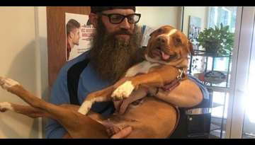 Adoptive Dog Dad Carries Paralyzed Shelter Pup Off To Her New Life