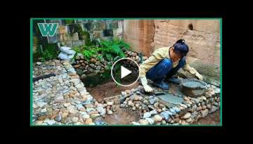 Young girl building and renovating a beautiful small garden with her own hands